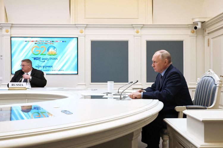 Vladimir Putin in collegamento video con il G20 - Afp