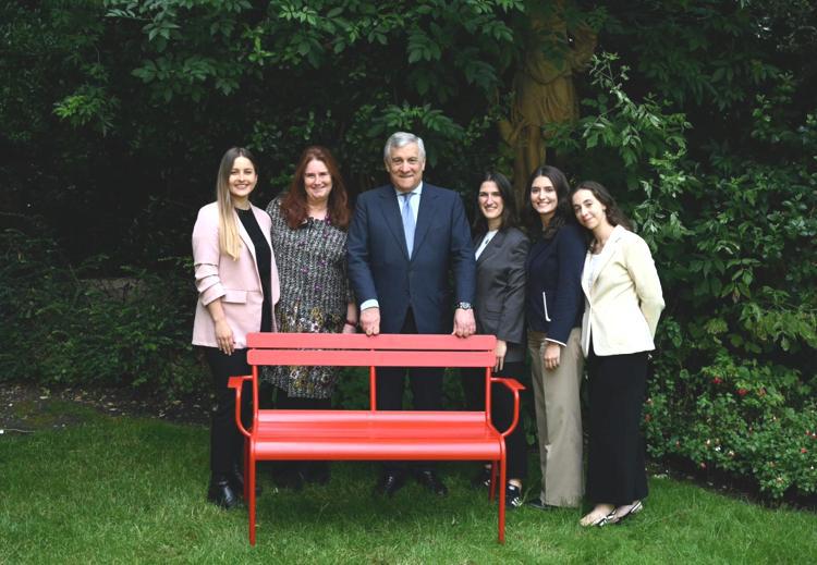 Tajani snapped behind empty red bench in Paris symbolising opposition to violence, abuse of women
