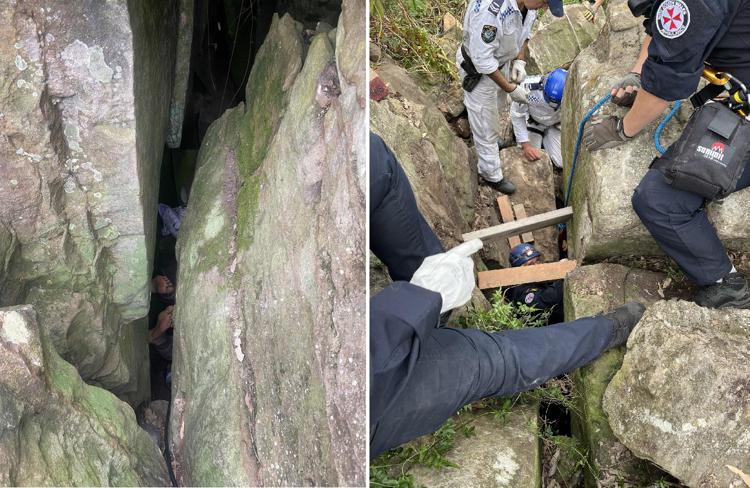 Soccorritori mentre salvano donna rimasta bloccata nelle rocce a testa in giù