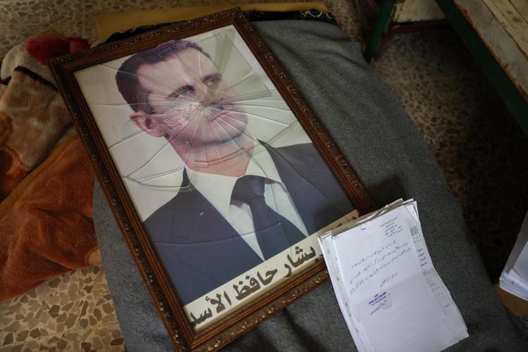 Un ritratto di Bashar al-Assad - (Afp)